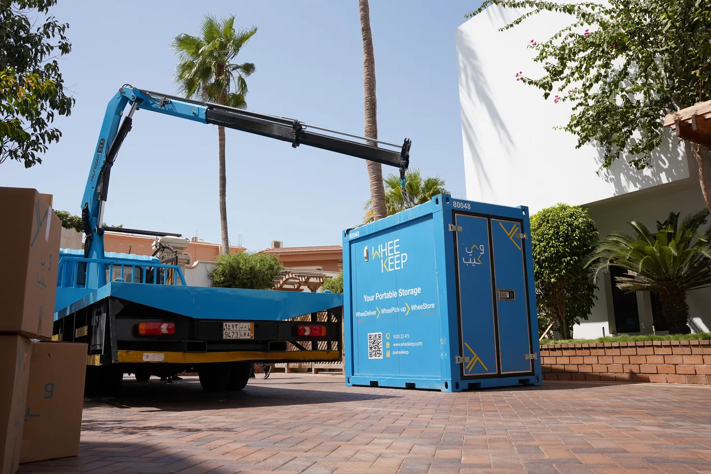 WheeKeep unit being delivered while boxes wait to be loaded