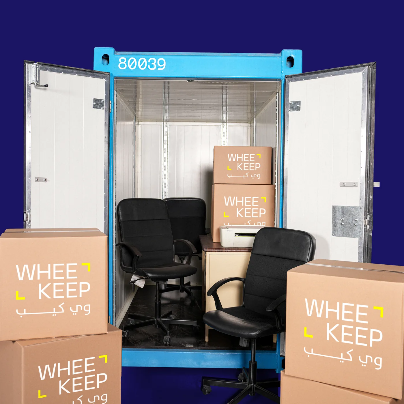 Inside an organised WheeKeep storage unit with labelled boxes and office chairs