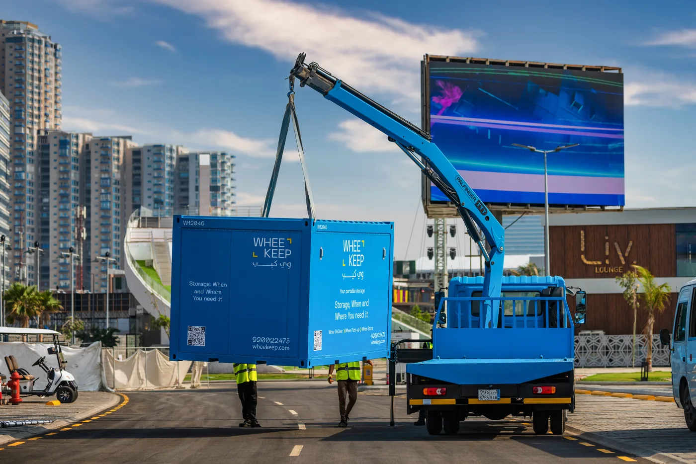 WheeKeep storage unit being lifted by crane truck for delivery